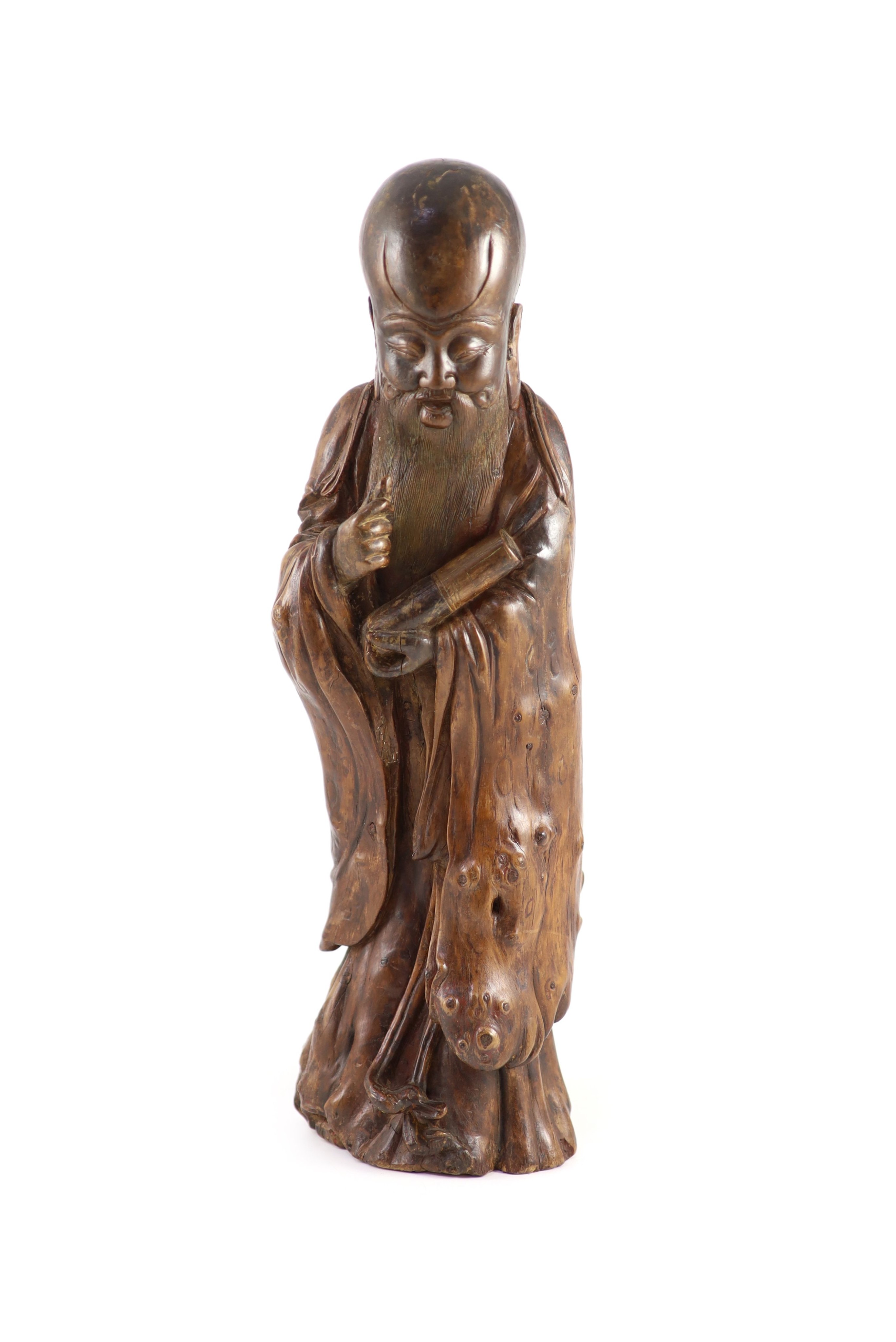 A tall Chinese rootwood figure of Shou Lao, 17th/18th century, 46 cm high, missing the staff in his right hand